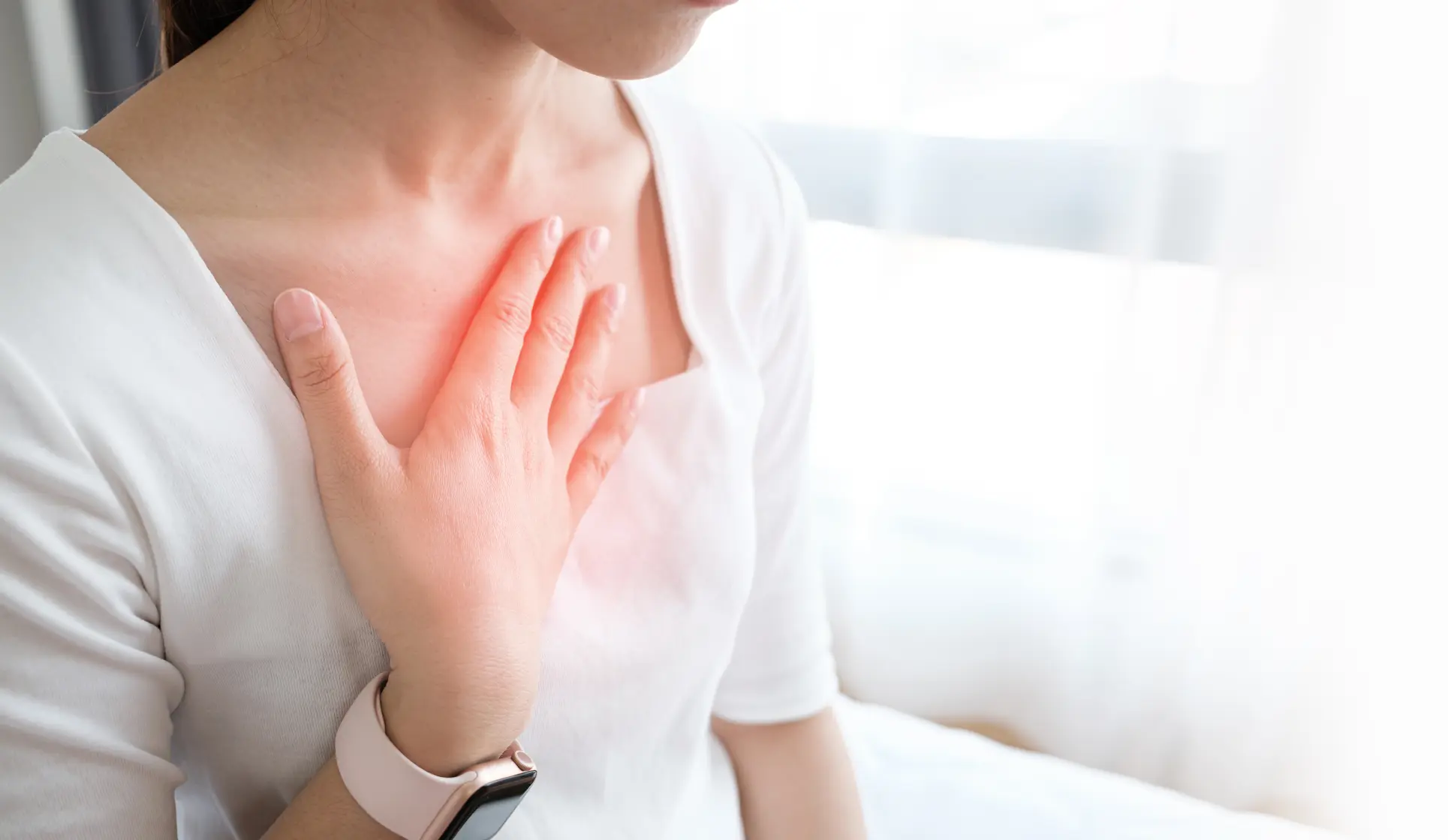 Woman experiencing heartburn from GERD